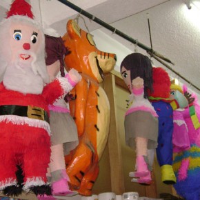 Santa and other piñatas in the market