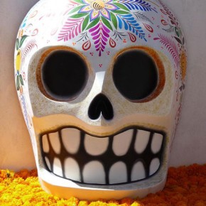 Ceramic skull atop marigolds in Bosque Village in Michoacan
