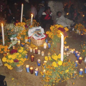 Famalies gather at the cemetery with food and offerings for the dead in Uruapan, Michoacan