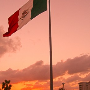 Mexican flag at sunset, Acapulco, Gro.