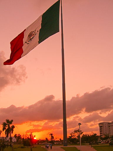 Mexican flag at sunset, Acapulco, Gro.